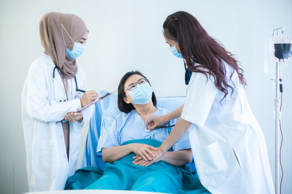 female patients wearing surgical face mask